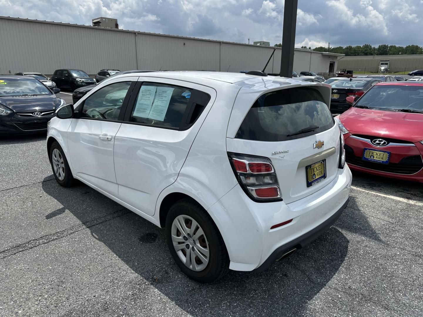 2018 WHITE Chevrolet Sonic FL Auto Hatchback (1G1JG6SG0J4) with an 1.8L L4 DOHC 24V engine, 6A transmission, located at 1254 Manheim Pike, Lancaster, PA, 17601, (717) 393-9133, 40.062870, -76.323273 - Photo#4