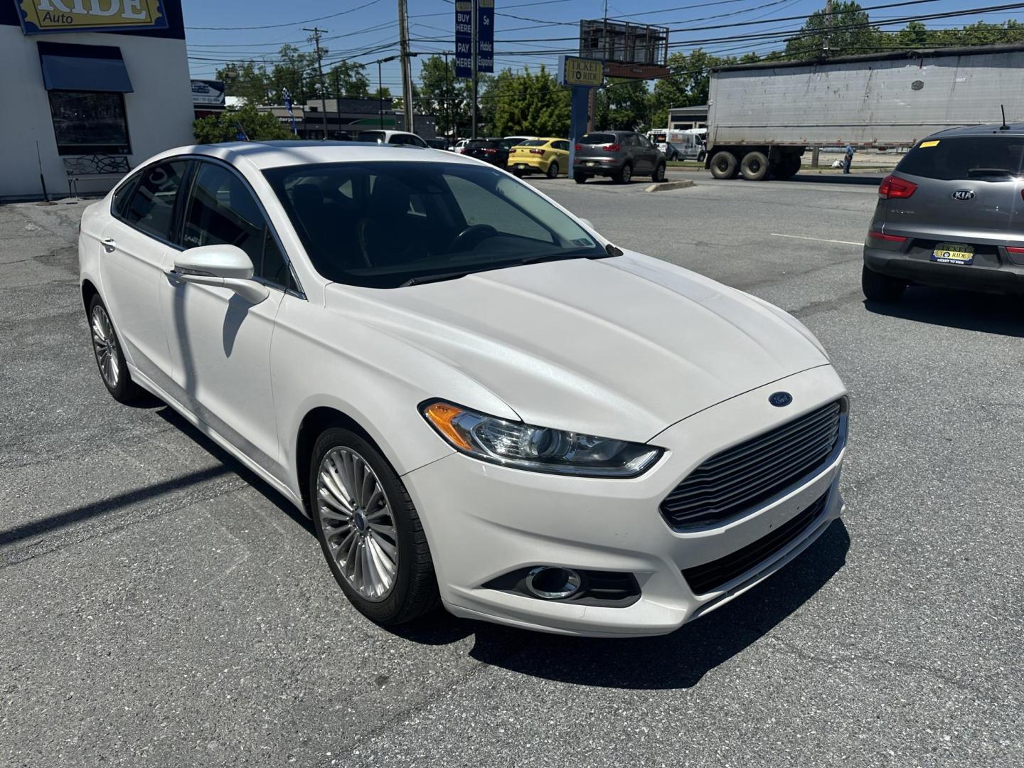 2016 WHITE Ford Fusion Titanium AWD (3FA6P0D92GR) with an 2.0L L4 DOHC 16V engine, 6A transmission, located at 1254 Manheim Pike, Lancaster, PA, 17601, (717) 393-9133, 40.062870, -76.323273 - Photo#2