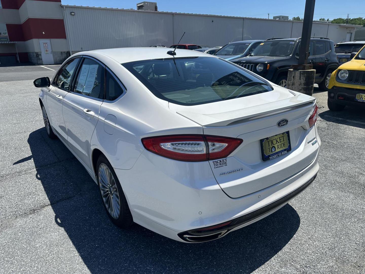 2016 WHITE Ford Fusion Titanium AWD (3FA6P0D92GR) with an 2.0L L4 DOHC 16V engine, 6A transmission, located at 1254 Manheim Pike, Lancaster, PA, 17601, (717) 393-9133, 40.062870, -76.323273 - Photo#4