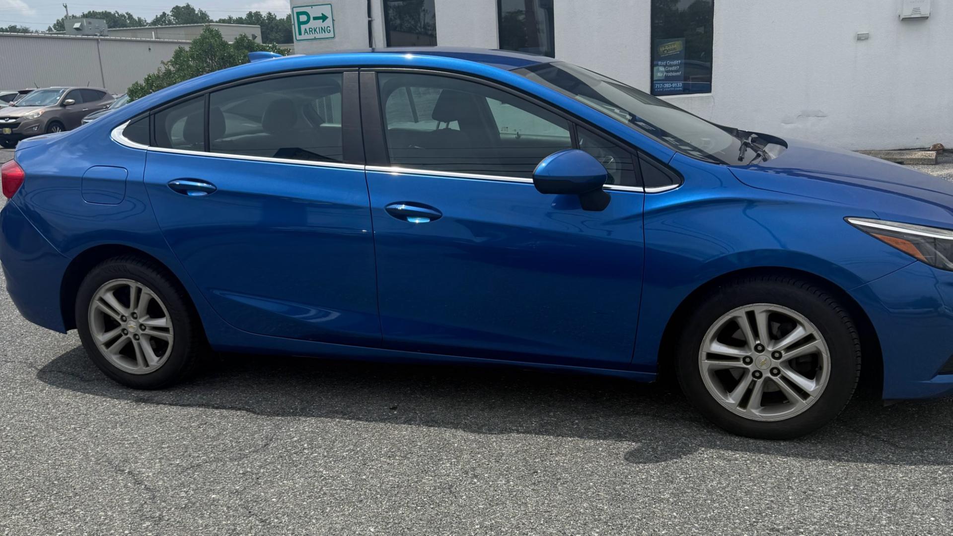 2016 BLUE Chevrolet Cruze LT Auto (1G1BE5SM1G7) with an 1.4L L4 DOHC 16V TURBO engine, 6A transmission, located at 1254 Manheim Pike, Lancaster, PA, 17601, (717) 393-9133, 40.062870, -76.323273 - The 2016 Chevrolet Cruze LT is a comfortable and efficient sedan that’s perfect for commuting, running errands, or everyday driving. It offers a smooth ride, a fuel-efficient turbocharged engine, and convenient features such as Bluetooth connectivity and a rearview camera. With its modern styling,- Photo#3
