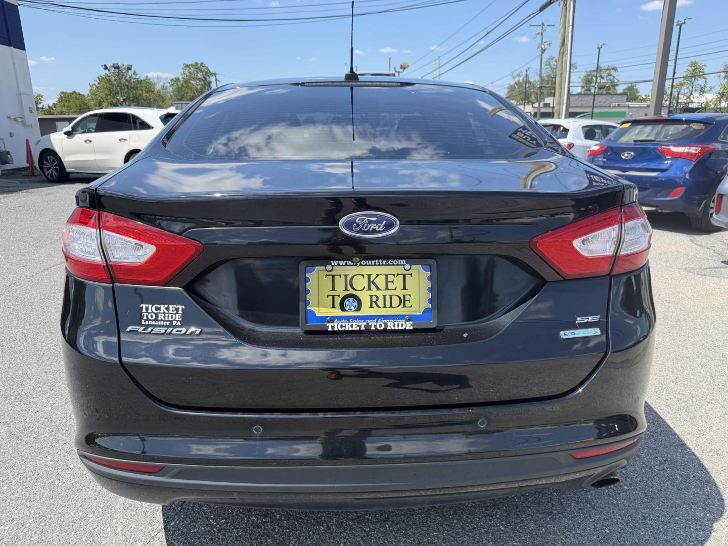 2016 BLACK Ford Fusion SE (3FA6P0HDXGR) with an 1.5L L4 DOHC 16V engine, 6A transmission, located at 1254 Manheim Pike, Lancaster, PA, 17601, (717) 393-9133, 40.062870, -76.323273 - Stylish, comfortable, and ready to go! The 2016 Ford Fusion SE offers a smooth ride, a roomy interior, and sharp styling that still looks great today. Whether you’re commuting to work or heading out for the weekend, this midsize sedan delivers comfort, practicality, and value. Bad credit or no- Photo#2
