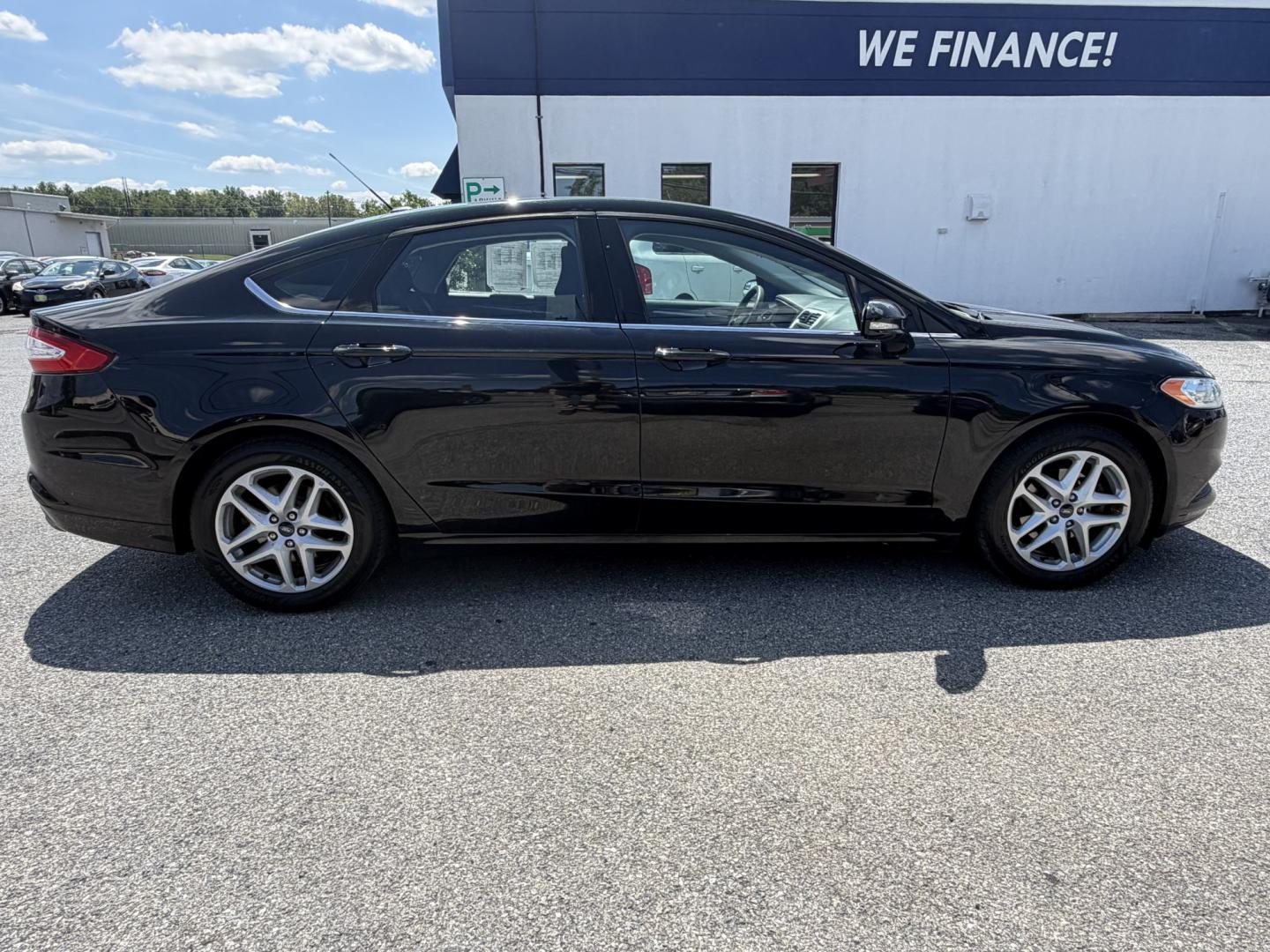 2016 BLACK Ford Fusion SE (3FA6P0HDXGR) with an 1.5L L4 DOHC 16V engine, 6A transmission, located at 1254 Manheim Pike, Lancaster, PA, 17601, (717) 393-9133, 40.062870, -76.323273 - Stylish, comfortable, and ready to go! The 2016 Ford Fusion SE offers a smooth ride, a roomy interior, and sharp styling that still looks great today. Whether you’re commuting to work or heading out for the weekend, this midsize sedan delivers comfort, practicality, and value. Bad credit or no- Photo#4