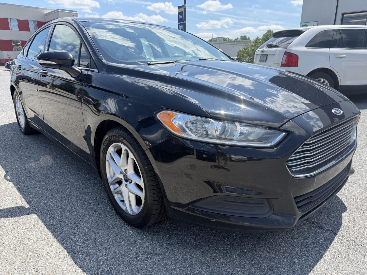 2016 BLACK Ford Fusion SE (3FA6P0HDXGR) with an 1.5L L4 DOHC 16V engine, 6A transmission, located at 1254 Manheim Pike, Lancaster, PA, 17601, (717) 393-9133, 40.062870, -76.323273 - Stylish, comfortable, and ready to go! The 2016 Ford Fusion SE offers a smooth ride, a roomy interior, and sharp styling that still looks great today. Whether you’re commuting to work or heading out for the weekend, this midsize sedan delivers comfort, practicality, and value. Bad credit or no- Photo#5