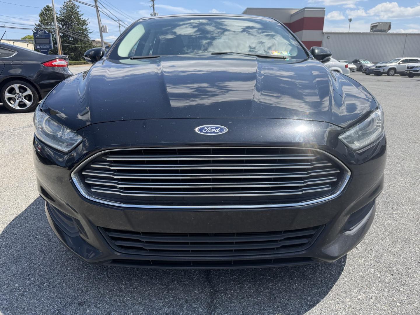 2016 BLACK Ford Fusion SE (3FA6P0HDXGR) with an 1.5L L4 DOHC 16V engine, 6A transmission, located at 1254 Manheim Pike, Lancaster, PA, 17601, (717) 393-9133, 40.062870, -76.323273 - Stylish, comfortable, and ready to go! The 2016 Ford Fusion SE offers a smooth ride, a roomy interior, and sharp styling that still looks great today. Whether you’re commuting to work or heading out for the weekend, this midsize sedan delivers comfort, practicality, and value. Bad credit or no- Photo#6