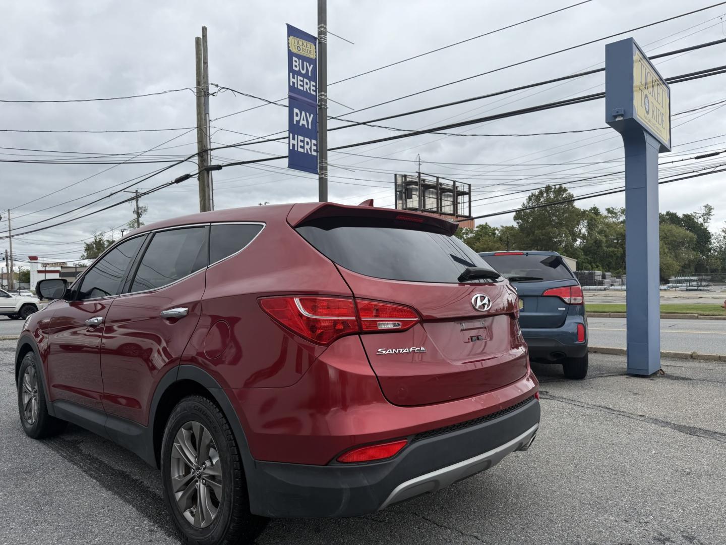 2013 RED Hyundai Santa Fe Sport 2.4 FWD (5XYZT3LB3DG) with an 2.4L L4 DOHC 16V engine, 6-Speed Automatic transmission, located at 1254 Manheim Pike, Lancaster, PA, 17601, (717) 393-9133, 40.062870, -76.323273 - Make the most of your daily drive with this 2013 Hyundai Santa Fe Sport 2.4 FWD! With a sporty look, a spacious interior, and versatile cargo space, this SUV is a practical fit for busy weekdays and weekend adventures. Visit Ticket To Ride Auto Sales in Lancaster to take a closer look and explore fi- Photo#2