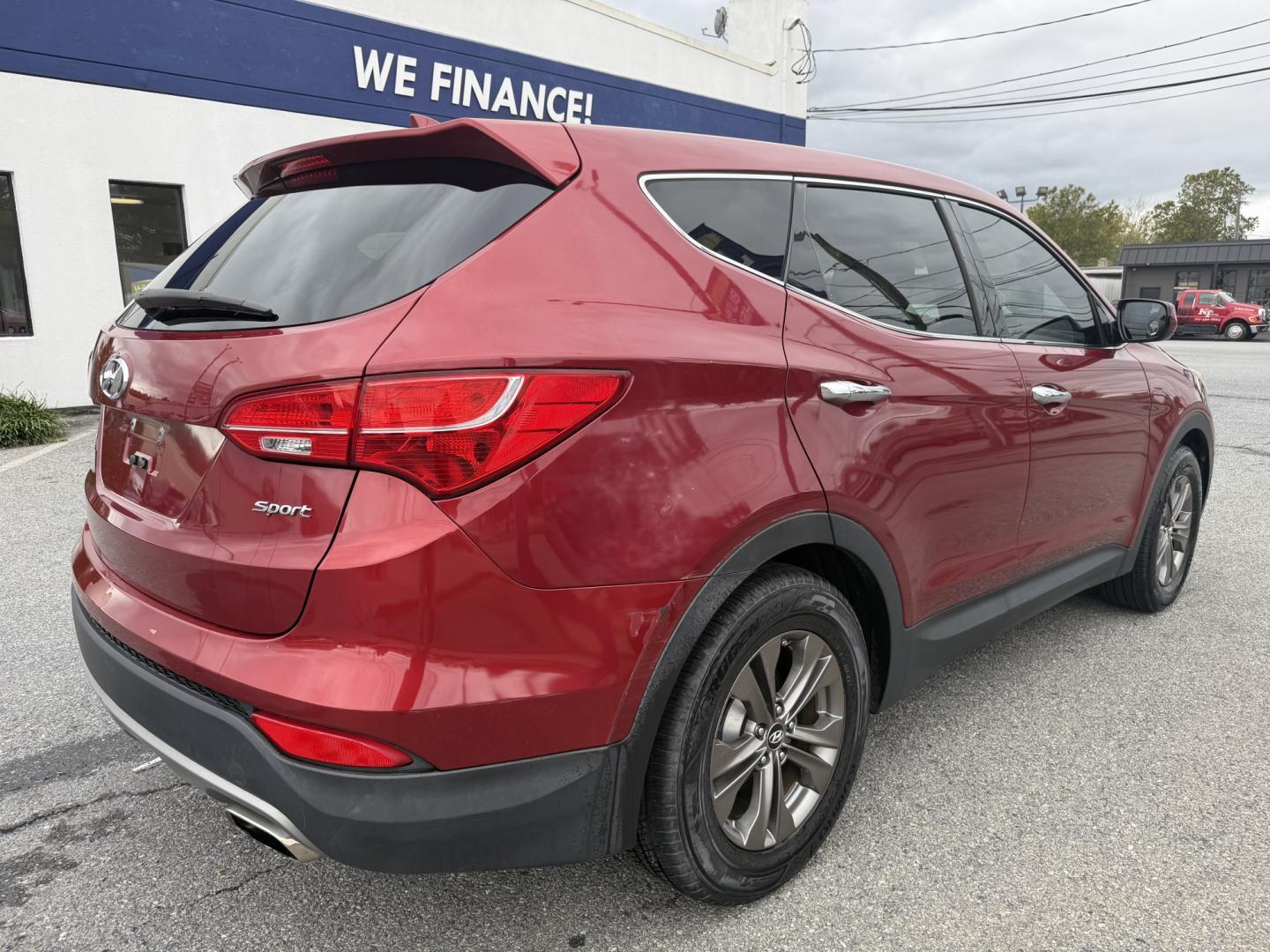 2013 RED Hyundai Santa Fe Sport 2.4 FWD (5XYZT3LB3DG) with an 2.4L L4 DOHC 16V engine, 6-Speed Automatic transmission, located at 1254 Manheim Pike, Lancaster, PA, 17601, (717) 393-9133, 40.062870, -76.323273 - Make the most of your daily drive with this 2013 Hyundai Santa Fe Sport 2.4 FWD! With a sporty look, a spacious interior, and versatile cargo space, this SUV is a practical fit for busy weekdays and weekend adventures. Visit Ticket To Ride Auto Sales in Lancaster to take a closer look and explore fi- Photo#3