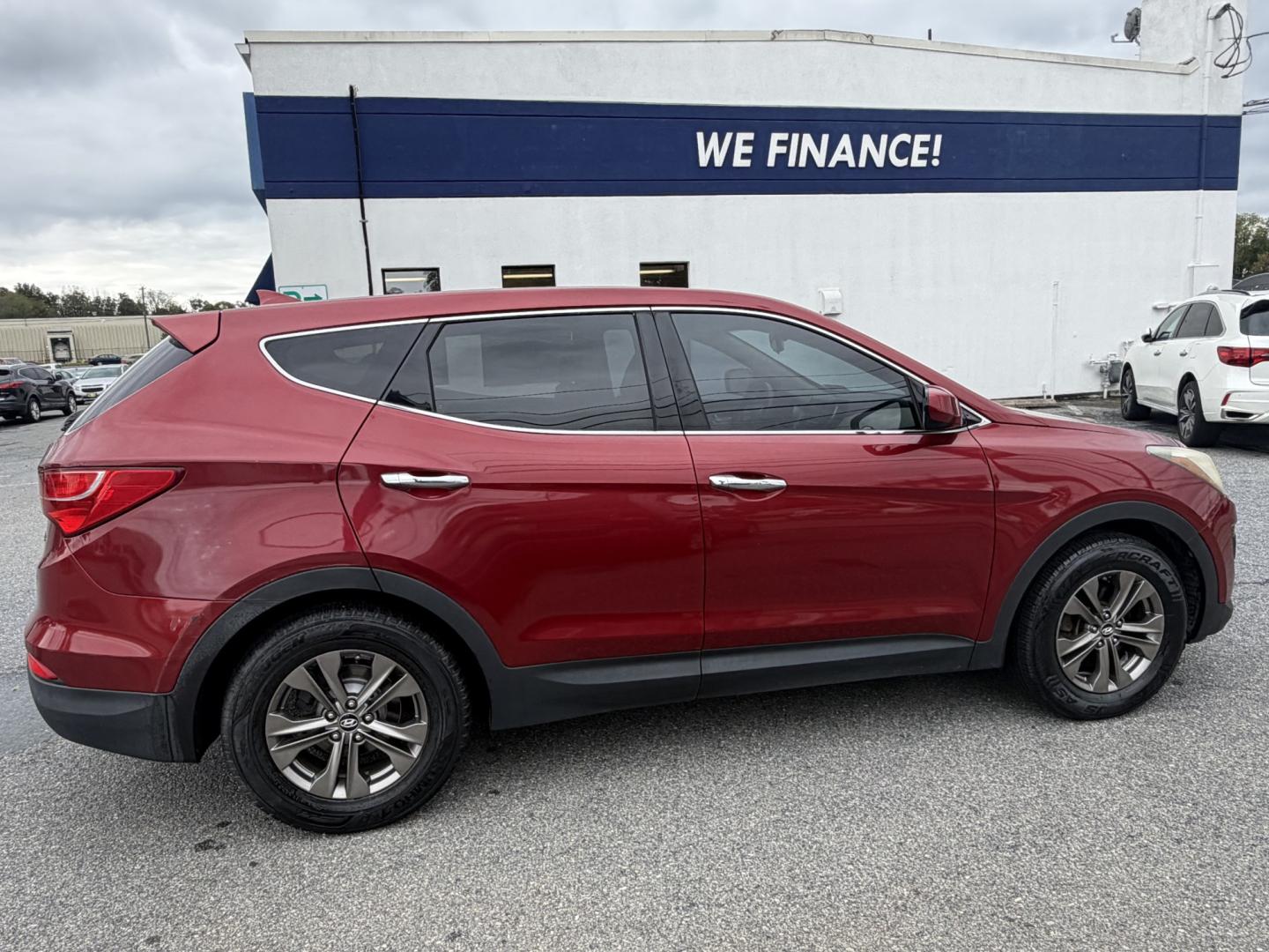2013 RED Hyundai Santa Fe Sport 2.4 FWD (5XYZT3LB3DG) with an 2.4L L4 DOHC 16V engine, 6-Speed Automatic transmission, located at 1254 Manheim Pike, Lancaster, PA, 17601, (717) 393-9133, 40.062870, -76.323273 - Make the most of your daily drive with this 2013 Hyundai Santa Fe Sport 2.4 FWD! With a sporty look, a spacious interior, and versatile cargo space, this SUV is a practical fit for busy weekdays and weekend adventures. Visit Ticket To Ride Auto Sales in Lancaster to take a closer look and explore fi- Photo#4