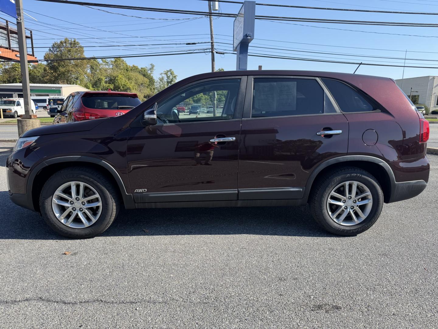 2015 MAROON Kia Sorento LX AWD (5XYKTCA6XFG) with an 2.4L L4 DOHC 16V engine, 6-Speed Automatic transmission, located at 1254 Manheim Pike, Lancaster, PA, 17601, (717) 393-9133, 40.062870, -76.323273 - Make room for your daily routine and weekend adventures in this 2015 Kia Sorento LX AWD! This versatile SUV offers a spacious interior and flexible cargo space for groceries, sports gear, or luggage. All-wheel drive adds traction when road conditions change, while its convenient four-door design mak- Photo#1