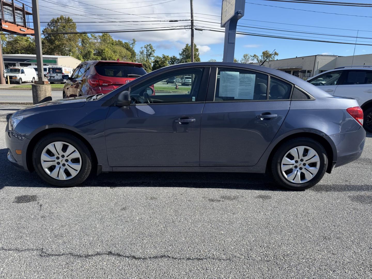2014 BLUE Chevrolet Cruze LS Auto (1G1PA5SG1E7) with an 1.8L L4 DOHC 16V engine, 6-Speed Automatic transmission, located at 1254 Manheim Pike, Lancaster, PA, 17601, (717) 393-9133, 40.062870, -76.323273 - Bring style and practicality to your daily drive with this 2014 Chevrolet Cruze LS! This compact sedan pairs a sleek four-door design with the convenience of an automatic transmission, making it an appealing choice for commuting through Lancaster, running errands, and weekend outings. Its cabin offe- Photo#1