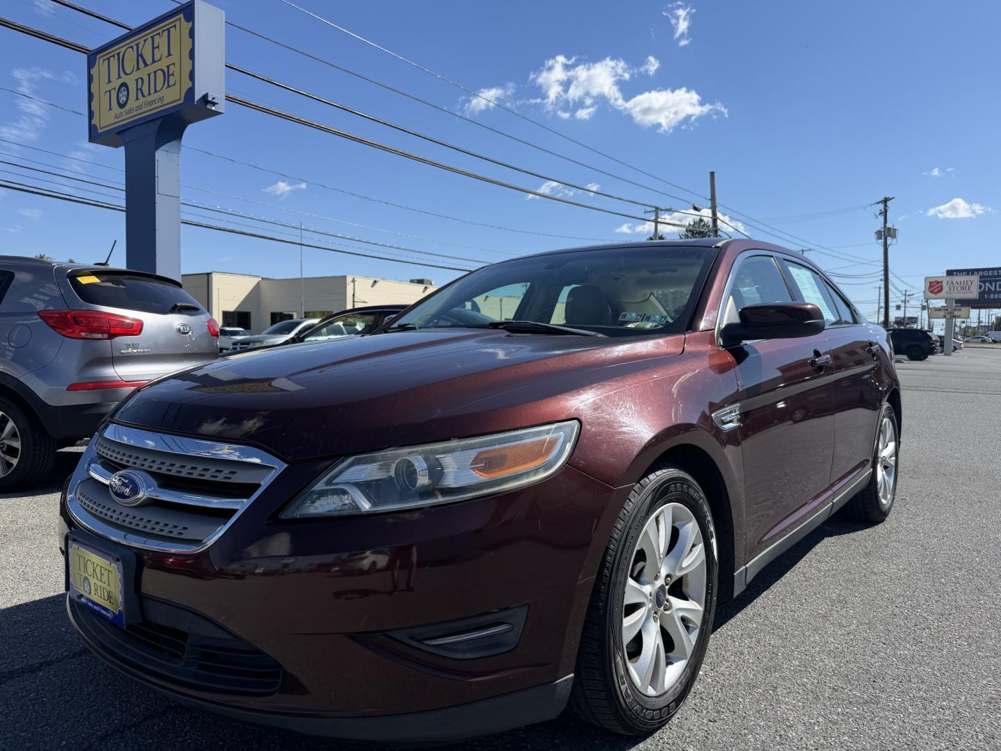 2012 MAROON Ford Taurus SEL FWD (1FAHP2EWXCG) with an 3.5L V6 DOHC 24V engine, 6-Speed Automatic transmission, located at 1254 Manheim Pike, Lancaster, PA, 17601, (717) 393-9133, 40.062870, -76.323273 - Enjoy comfort and style in this 2012 Ford Taurus SEL FWD! With a spacious interior and generous trunk space, this sedan is a practical choice for your daily commute, family outings, and weekend trips. Visit Ticket To Ride Auto Sales in Lancaster to take a closer look and explore financing options fo- Photo#0