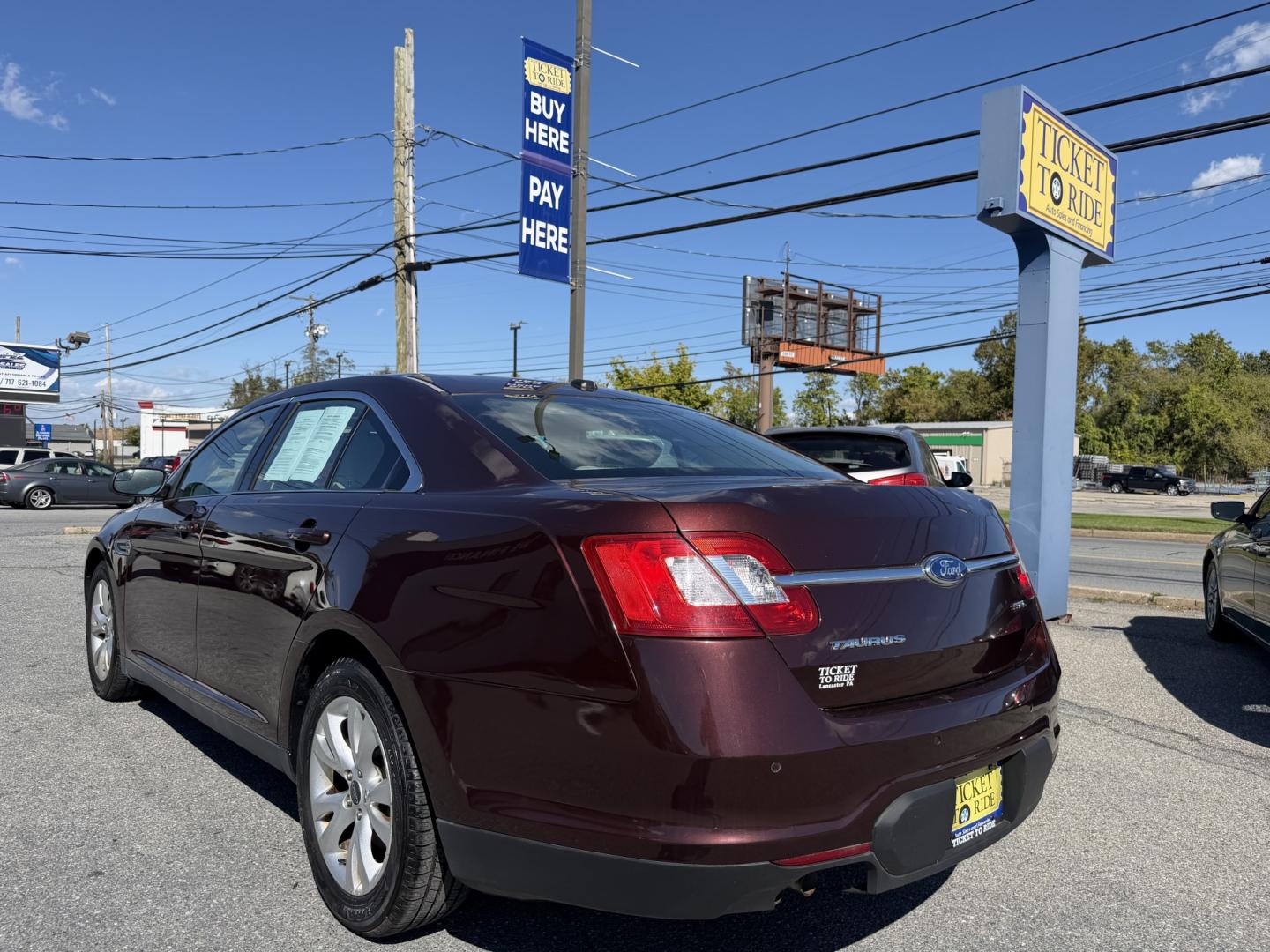 2012 MAROON Ford Taurus SEL FWD (1FAHP2EWXCG) with an 3.5L V6 DOHC 24V engine, 6-Speed Automatic transmission, located at 1254 Manheim Pike, Lancaster, PA, 17601, (717) 393-9133, 40.062870, -76.323273 - Enjoy comfort and style in this 2012 Ford Taurus SEL FWD! With a spacious interior and generous trunk space, this sedan is a practical choice for your daily commute, family outings, and weekend trips. Visit Ticket To Ride Auto Sales in Lancaster to take a closer look and explore financing options fo- Photo#2