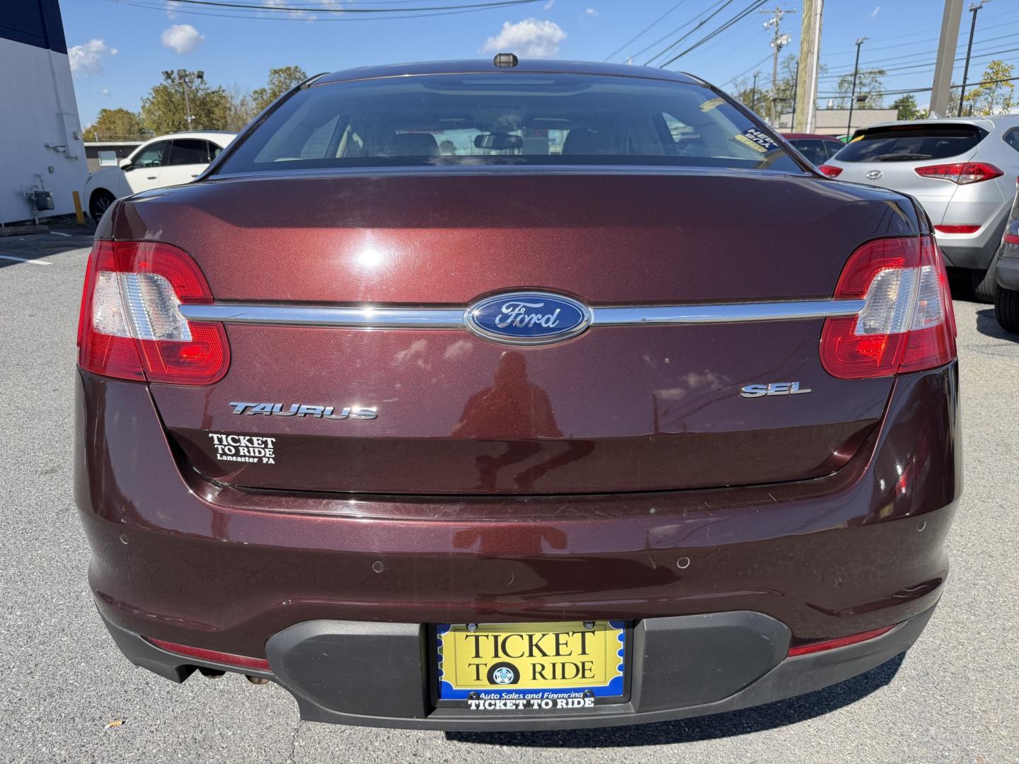 2012 MAROON Ford Taurus SEL FWD (1FAHP2EWXCG) with an 3.5L V6 DOHC 24V engine, 6-Speed Automatic transmission, located at 1254 Manheim Pike, Lancaster, PA, 17601, (717) 393-9133, 40.062870, -76.323273 - Enjoy comfort and style in this 2012 Ford Taurus SEL FWD! With a spacious interior and generous trunk space, this sedan is a practical choice for your daily commute, family outings, and weekend trips. Visit Ticket To Ride Auto Sales in Lancaster to take a closer look and explore financing options fo- Photo#3