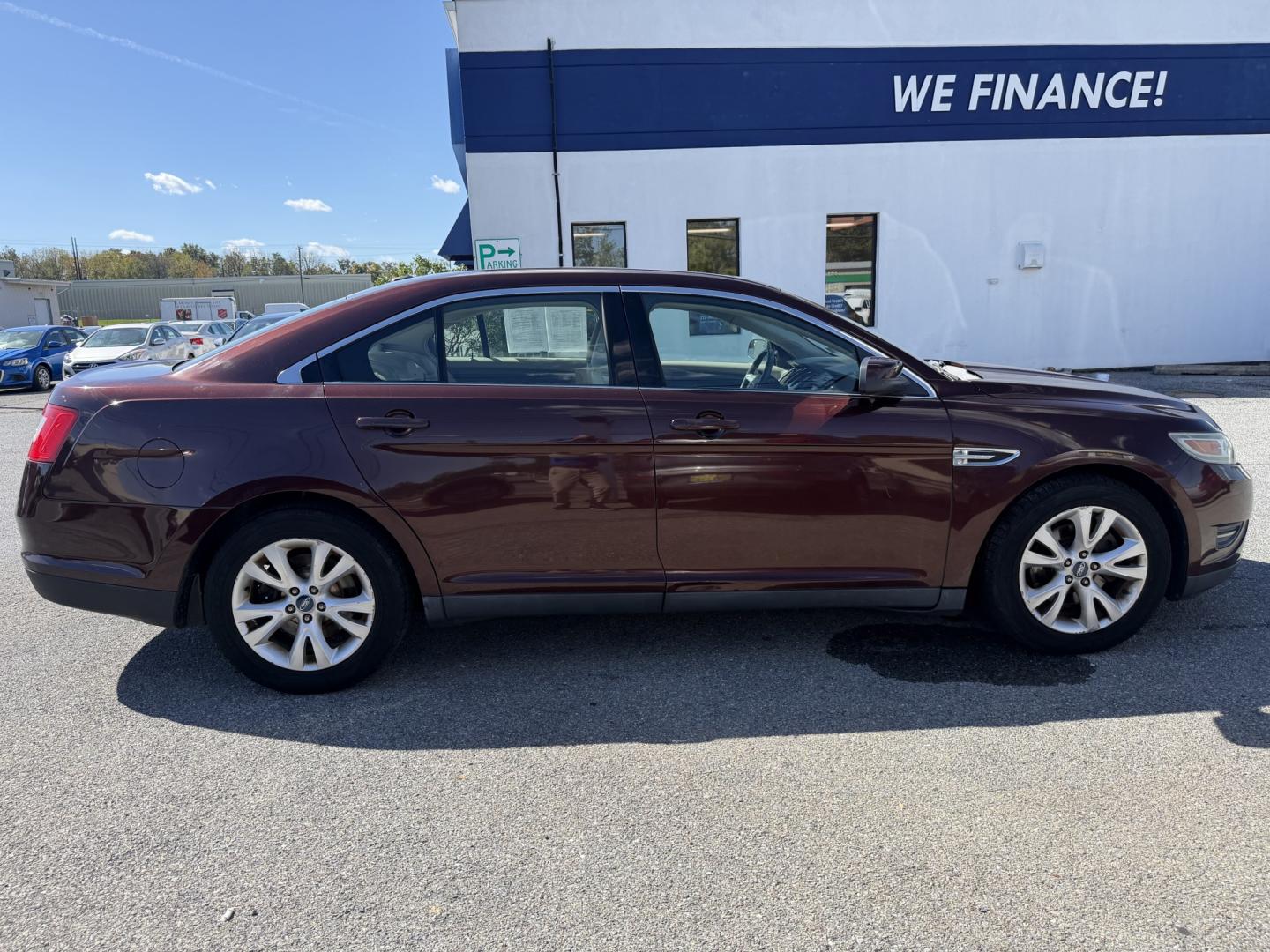 2012 MAROON Ford Taurus SEL FWD (1FAHP2EWXCG) with an 3.5L V6 DOHC 24V engine, 6-Speed Automatic transmission, located at 1254 Manheim Pike, Lancaster, PA, 17601, (717) 393-9133, 40.062870, -76.323273 - Enjoy comfort and style in this 2012 Ford Taurus SEL FWD! With a spacious interior and generous trunk space, this sedan is a practical choice for your daily commute, family outings, and weekend trips. Visit Ticket To Ride Auto Sales in Lancaster to take a closer look and explore financing options fo- Photo#5